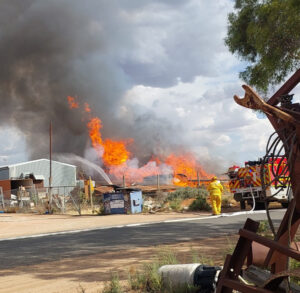 Timber pile blaze tests firefighters