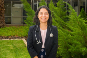 Khanal looks outside the medical box
