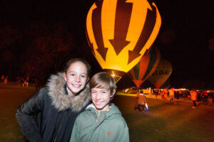 Faces glow as hot air balloons light up Mildura