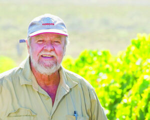 Happy grape growers enjoying a fine dry