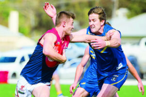 Caldwell, Russell to coach Demons