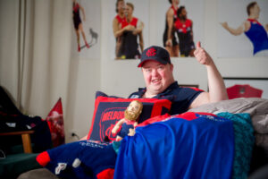 Dee-hard fan Jon Amos celebrates Melbourne’s big win