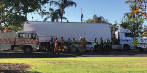 Car wedged under truck in Mildura