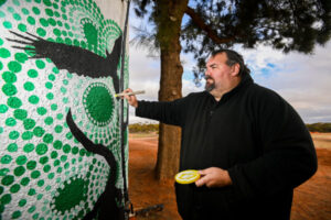 Dreamtime story told in cemetery mural