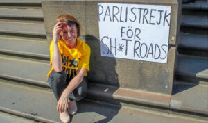 Ali Cupper strikes on parliament steps to protest roads