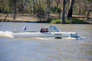 Car leaves paddlewheeler in its wake