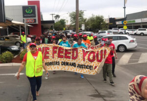 Farm workers rally for better pay, conditions