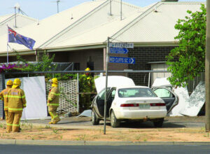 Car crashes into units