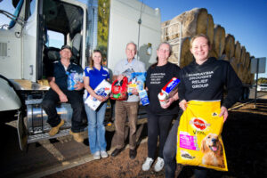 Trucks heading north, loaded with hope