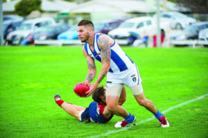 Farrer back in blue and white