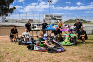 Dirt kart racers start engines