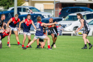 Merbein holds on against gallant young Demons