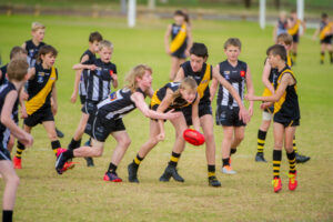 Change age groups in junior football now to avoid future woes
