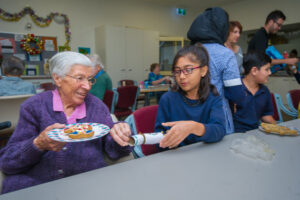 Smiles all round when students visit Princes Court Homes