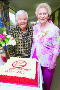 Volunteers mark 80 years