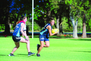 Brooke Hards happy juggling football and netball