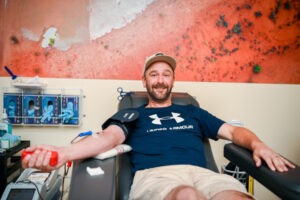 Winery workers donate a drop of red