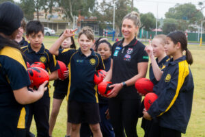 AFLW player Hannah Priest helps the next generation