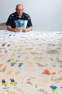 Police in the picture with Chief Commissioner’s 2019 Colouring Competition