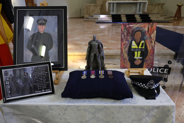 Solemn farewell for slain officers