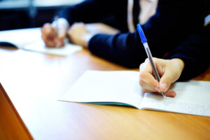 Students take their seats for exams