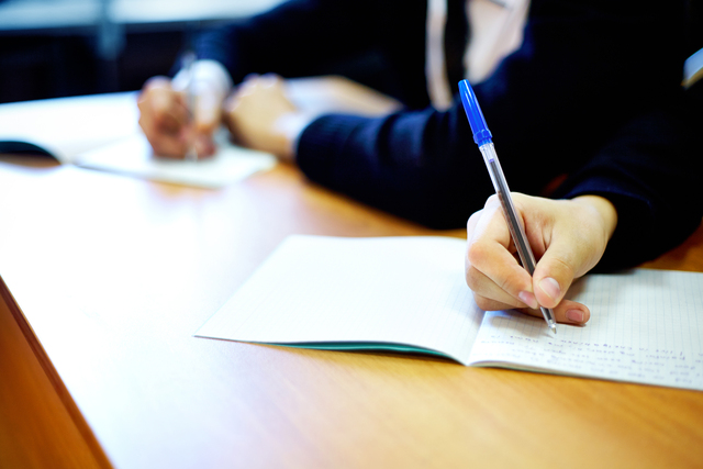 Students take their seats for exams