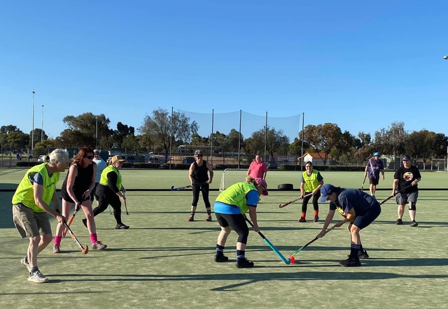 Walking hockey goes stick to stick